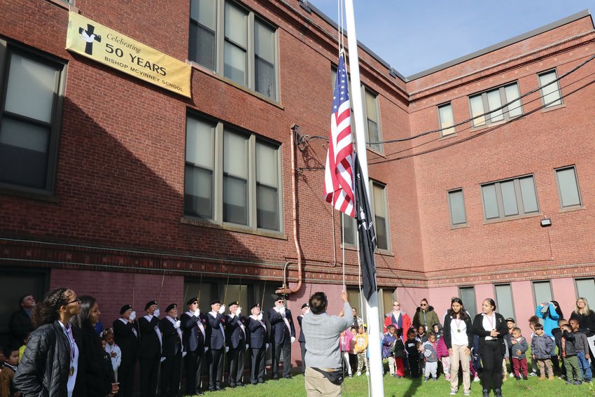 In the 97 years since the red brick school building that&rsquo;s housed both St. Michael School, and now Bishop McVinney School for the past 50 years, there was never a flagpole on grounds. The Knights of Columbus stepped in to change that history, raising the $2,500 needed to install a flagpole on the lawn.