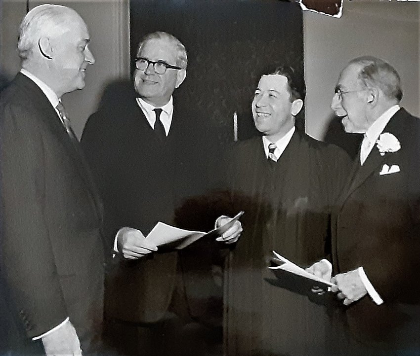 In a photo dated 1958, Pastor Homer Trickett, of the First Baptist Church in Providence, is pictured with Governor Dennis Roberts, Providence Mayor Walter H. Reynolds and U.S. Senator Theodore Francis Green. Pastor Trickett invited Bishop Russell J. McVinney, the fifth bishop of Providence, to speak at his church, setting into motion the ecumenical movement locally.
