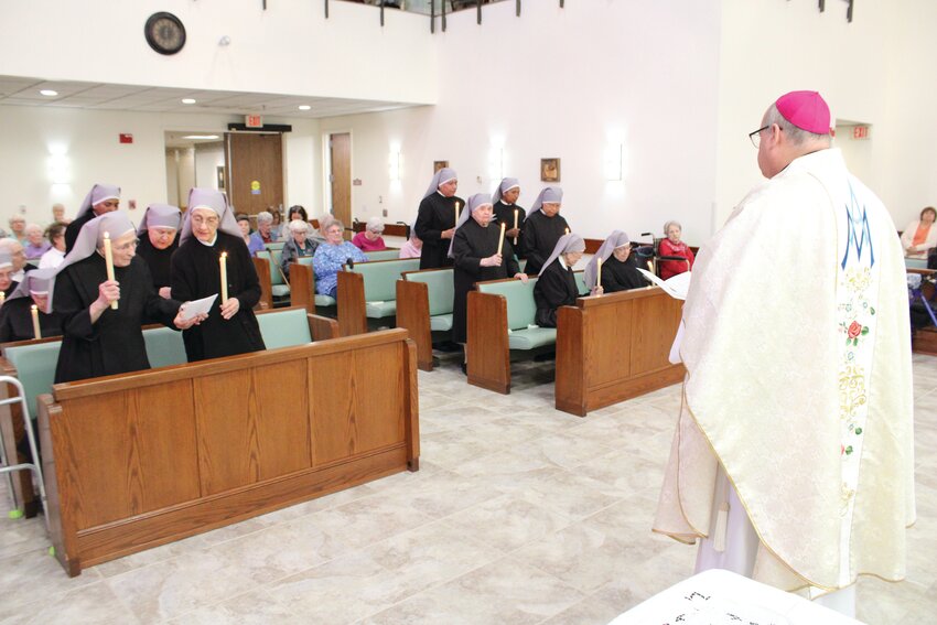 Local members of the Little Sisters of the Poor renew their vows in the presence of Bishop Richard G. Henning on the Feast of the Immaculate Conception.
