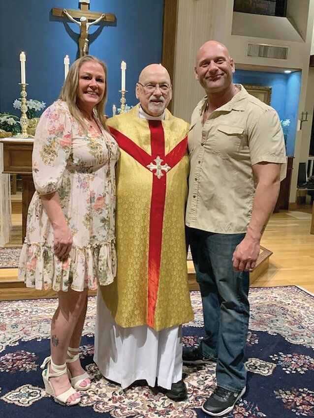 Leiah Michael, with Father Dennis Kieton and her boyfriend Christopher, a regular communicant, completed her OCIA program at Saints John and Paul Parish in Coventry and was welcomed into the Catholic Church at the Easter Vigil on Saturday.