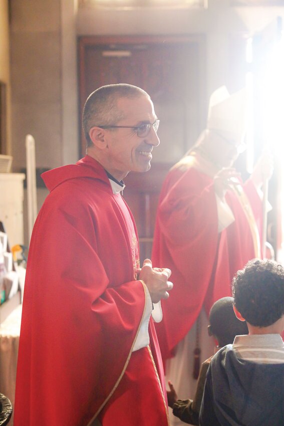 Father James T. Ruggieri smiles following the celebration of Mass for the students of Bishop McVinney School, Providence, in September 2023.