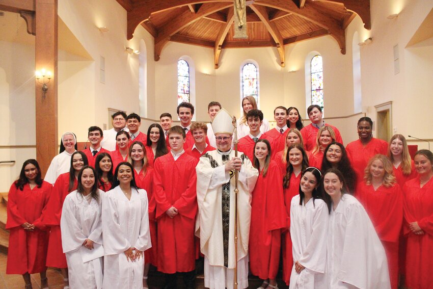 Students, clergy and faculty, gather at St. Dominic’s chapel at Providence College to celebrate the initiation of the newest members of the Catholic family.