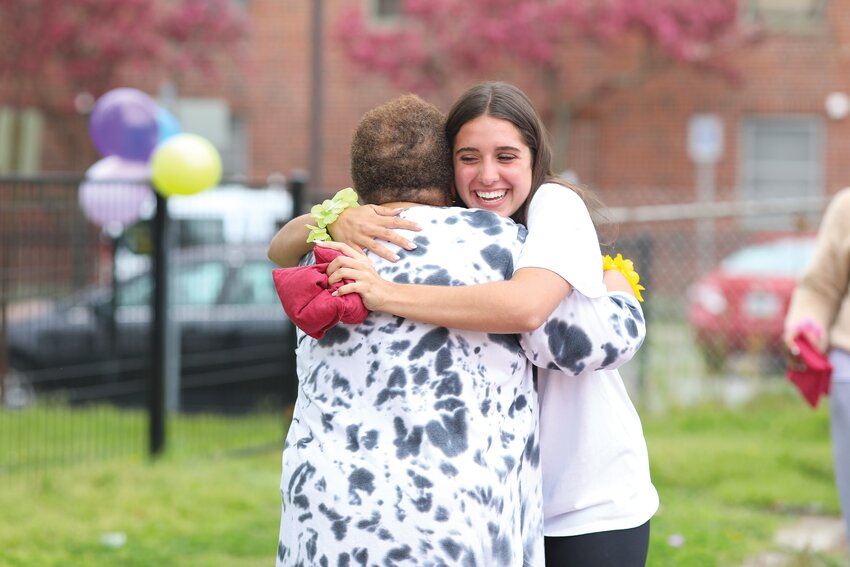 Freshmen from the Prout School in Wakefield planned a day of fun for the seniors at St. Martin de Porres Senior Center in Providence. The afternoon included prayer, games, music and food from Father Jean Joseph Brice and the Project Emmanuel food truck.