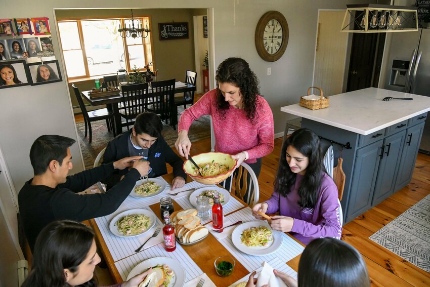 A Catholic family is pictured having dinner together at their home in Valatie, N.Y. (OSV News photo/Cindy Schultz via The Evangelist)