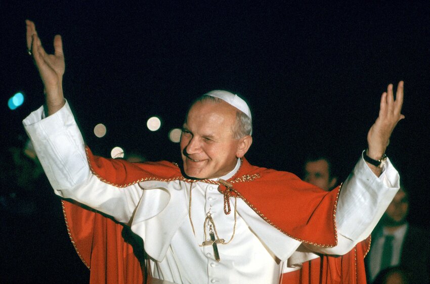St. John Paul II smiles during a 1980 visit to Paris in this file photo.