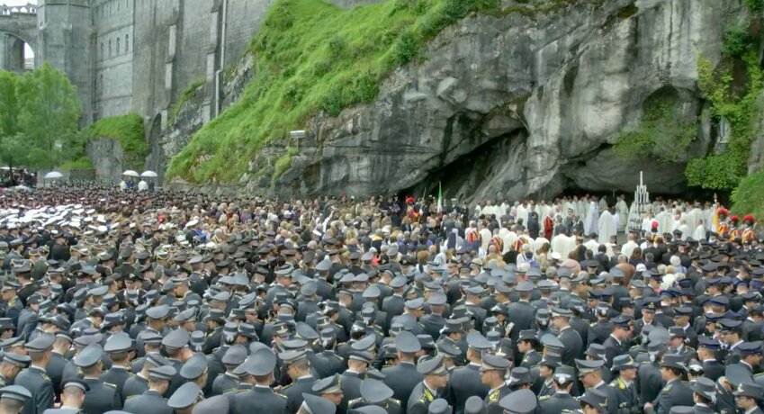 Members of the Italian military and of the Pontifical Swiss Guard are seen in this screen grab gathering for Mass at the grotto of the Shrine of Our Lady of Lourdes in France May 25, 2024.