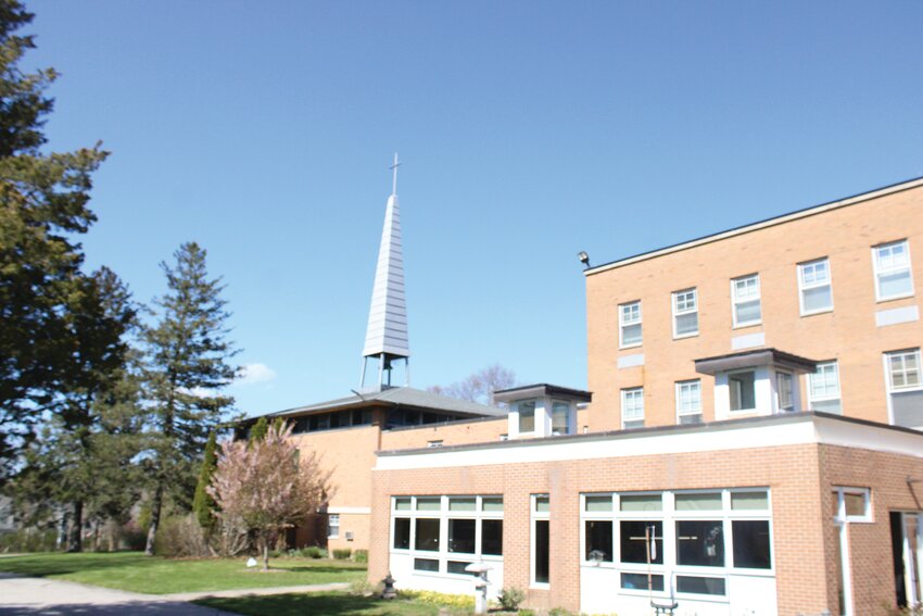 A recently deceased Catholic in the Diocese of Providence bequeathed $500,000 to the Columban Fathers to help ensure the continued operation of their retirement home for priests in Bristol. Above: the retirement home, with chapel in the background.