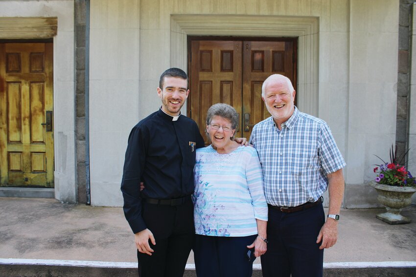 Rev. Mr. Joseph Brodeur embraces his parents Lora and Peter at St. Pius X Parish, Westerly.
