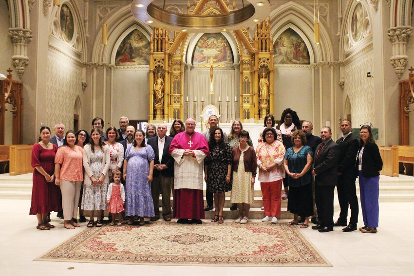 Students enrolled in the diocesan certification in Catholic Theology gather at the Cathedral of SS. Peter and Paul, Providence, as they are honored for their successful completion of the program.