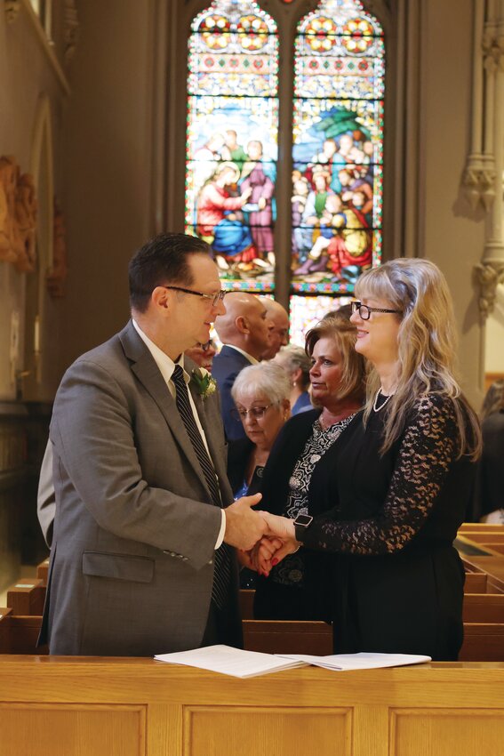 Timothy and Mary-Elizabeth DelGiudice join more than 180 couples in renewing their vows at the Cathedral of SS. Peter and Paul, Providence, this past Sunday.