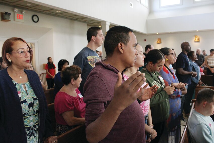 Rev. Msgr. Gerard O. Sabourin, parish administrator, celebrates Mass at St. Kateri Tekakwitha Catholic Community in Exeter before the 33rd annual SPRED Pic. Msgr. Sabourin has dedicated more than 50 years of his priestly ministry to helping people with disabilities.