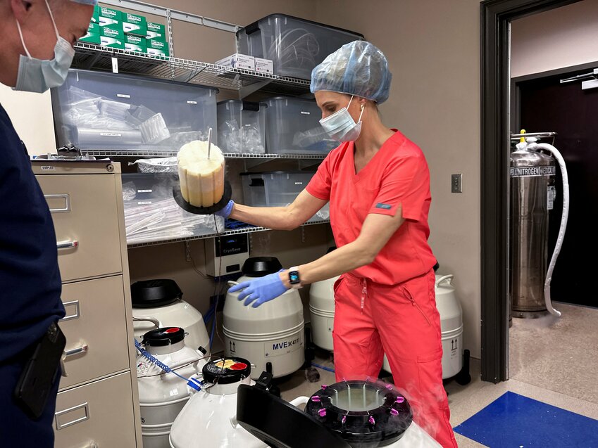 Dr. Andrew Harper, medical director for Huntsville Reproductive Medicine, P.C., looks on as Lynn Curry, nurse practitioner for Huntsville Reproductive Medicine, P.C., opens IVF cryopreservation dewar in Madison, Ala., March 4, 2024. U.S. President Donald Trump signed an executive order Feb. 19, 2025, to develop policy recommendations to expand access to and affordability of in vitro fertilization
