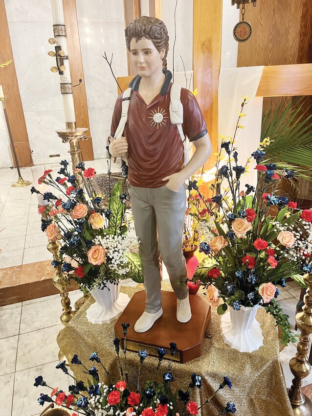 The new statue of Blessed Carlo Acutis stood close to the Blessed Sacrament at Our Lady of Mount Carmel on Divine Mercy Sunday.