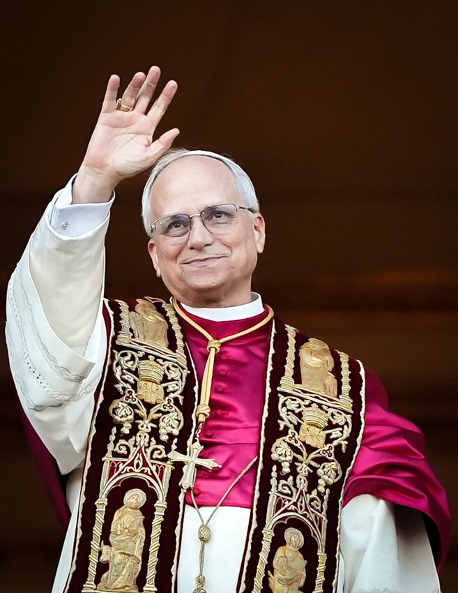 Pope Leo XIV, formerly Cardinal Robert F. Prevost, smiles as he appears at the central loggia of St. Peter’s Basilica at the Vatican following his election as pope May 8, 2025. The new pope was born in Chicago.