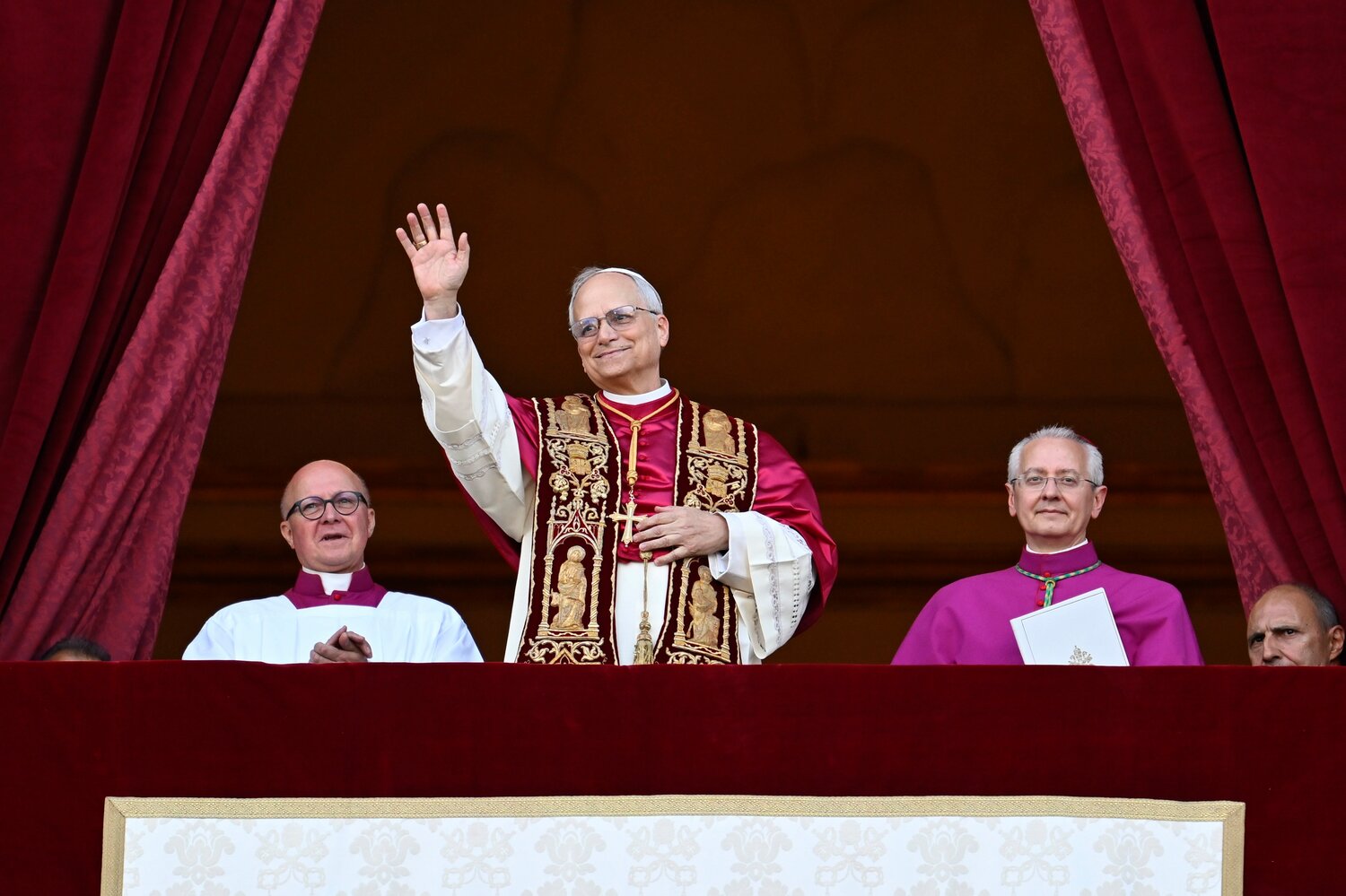 Pope Leo XIV, the former Cardinal Robert F. Prevost, waves to the crowds in St. Peter's Square at the Vatican after his election as pope May 8, 2025. The new pope was born in Chicago.