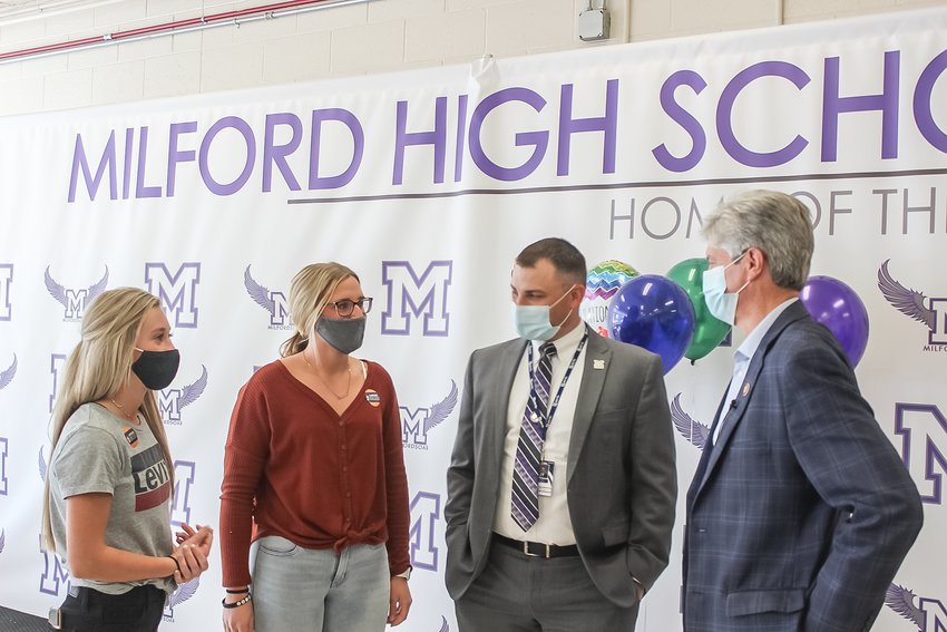 From left, Milford seniors Abby Houk and Makena Stutzman meet with principal Brandon Mowinkle and Congressman Jeff Fortenberry on Oct. 15.