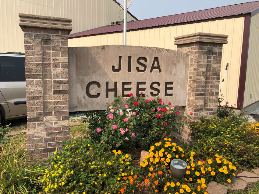 The sign outside of Jisa Cheese headquarters in Brainard welcomes visitors and employees.