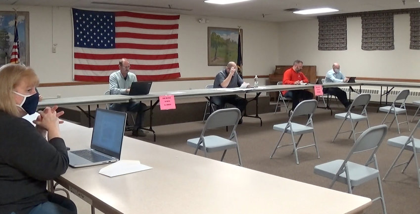 Seward City Council members attend a November meeting in-person before the council returned to Zoom in December.