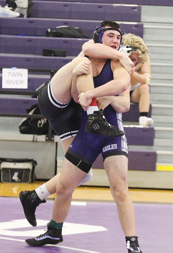 Thomas Vance of Milford sets up a takedown against Jed Jones of Twin River Dec. 22.