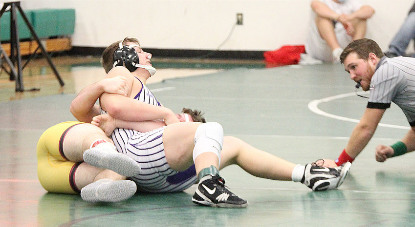 Milford freshman Hunter Oborny works to pin Domenic Hyson of Fairbury in the 195-pound championship match in the SNC tournament Jan. 30.
