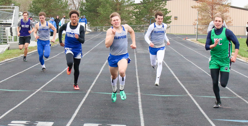 Malcolm's Dillon Beach powers to the finish line in the 400-meter dash April 7, beating, from left, Rollin Roth of Milford, Gavin Zoucha of Malcolm, Rayshun Foreman of Centennial, Colby Sizemore of Malcolm and Will Wenz of Wilber-Clatonia.