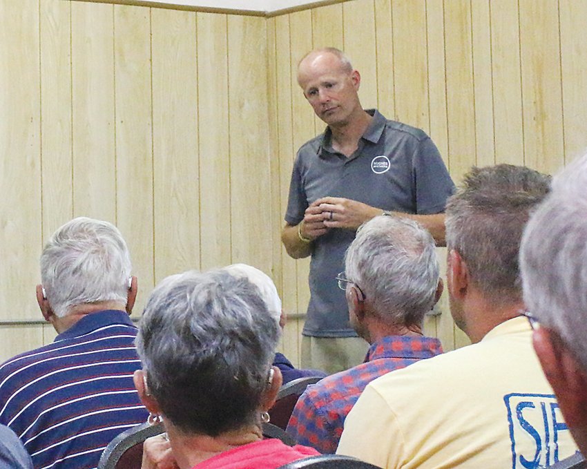 John Hughes listens to an audience question July 18 after his presentation at the Seward County Historial Society's quarterly meeting. Hughes is the president of Hughes Brothers in Seward and talked about their century of business.
