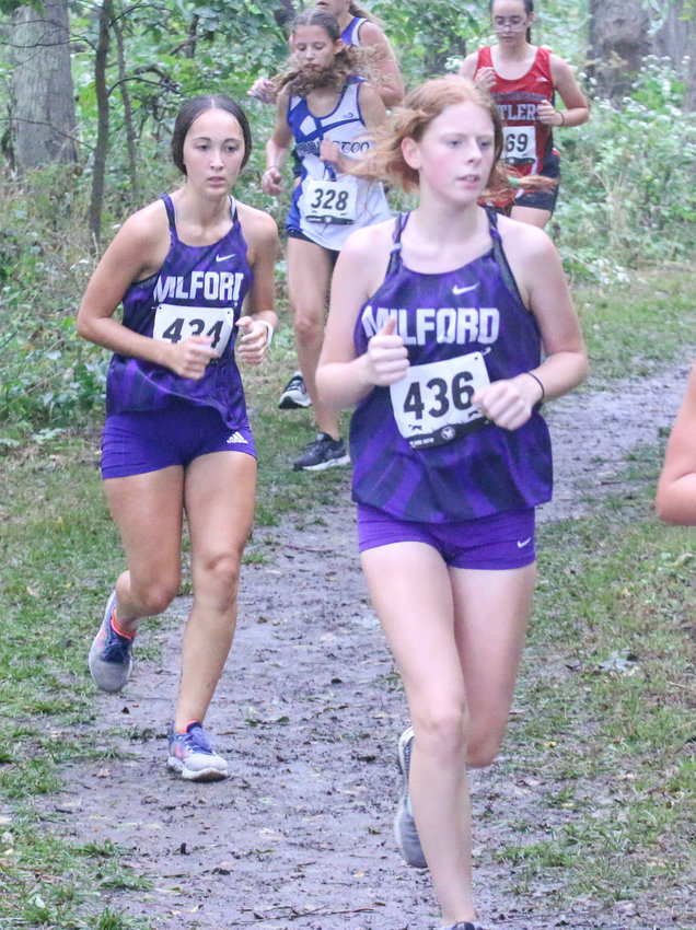 Victoria Mink (436) and Rebecca Freeman keep their pace during the Charlie Thorell Invitational at Seward Sept. 2.