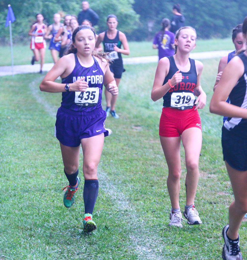 Eliza McGuire of Milford passes competitors near the end of the Charlie Thorell Invitational Sept. 2 in Seward.