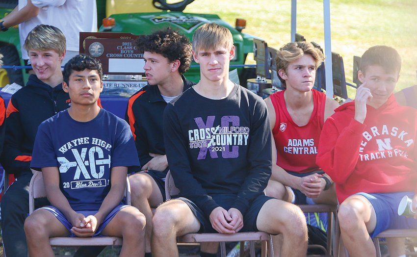 Elliott Reitz of Miford sits with the other Class C medal winners, waiting for the medal ceremony to begin Oct. 22.