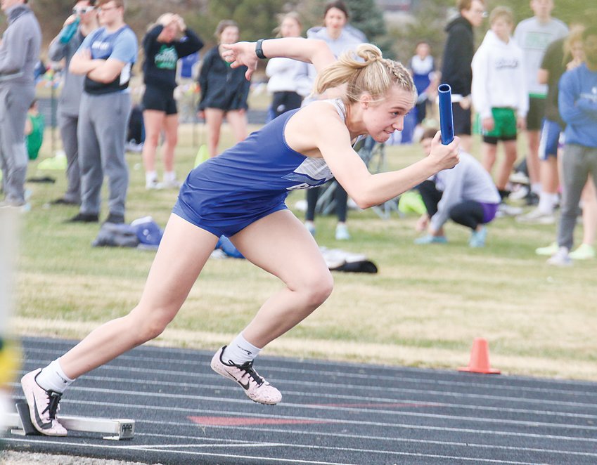 Centennial's Cambria Saunders leaves the starting block in the 4x100-meter relay March 29 at Wilber.