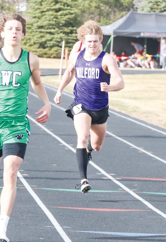 Carter Springer of Milford focuses on the finish line in the 400-meter dash March 29 at Wilber. Springer finished second.