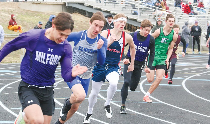 Tyce Lopez (left) and Ayden Shook of Milford run the curve in the 200-meter dash April 6 at Milford. Shook was the event champion.