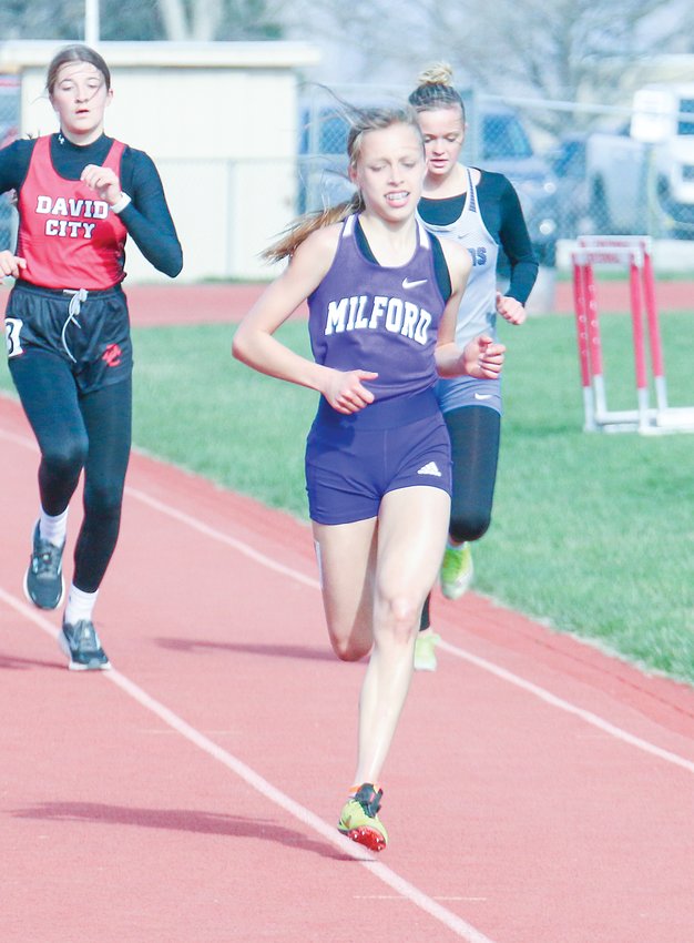 Lilly Kenning of Milford sprints the final few yards to the finish of teh 3,200-meter run April 19 at Centennial.