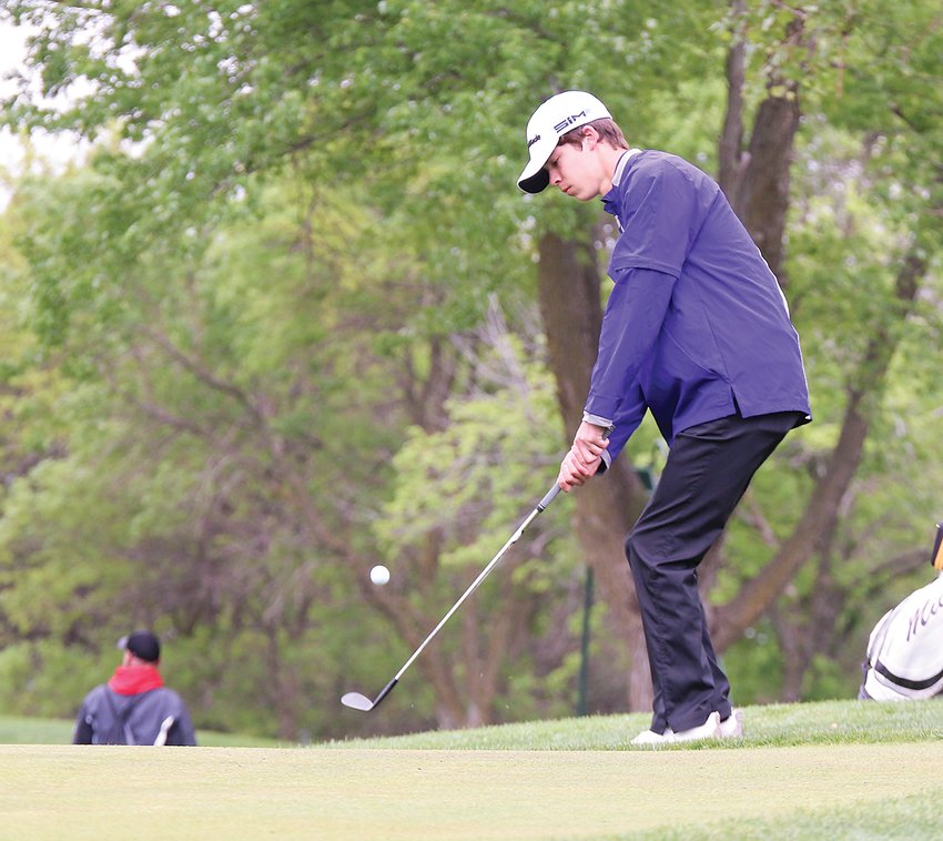 Maddox Baack chips onto the 10th green May 24 during the first round of state golf.
