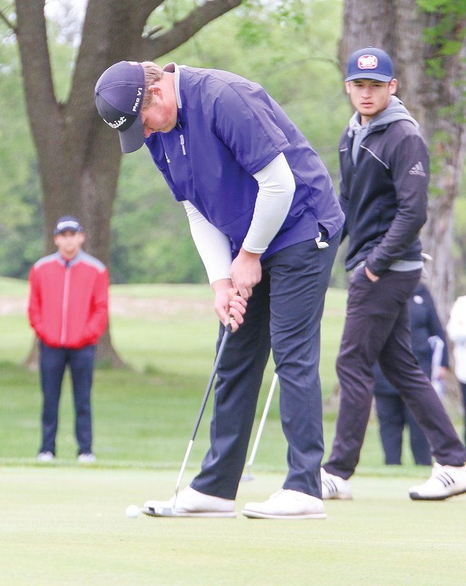 Colton Hauder lines up his putt on the first green May 24 during the first round of state golf.