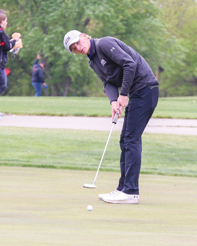Cole Toovey watches his putt on the ninth green during the first round of state golf May 24.
