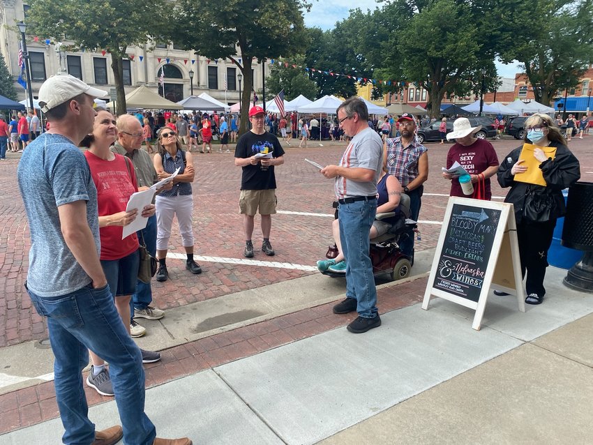 Jon Keller, local and author of "150 Years Around the Square," leads historic tour of the square on July 4 2022