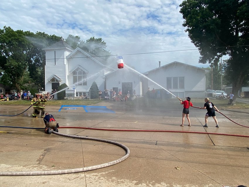 Contestants compete in the Seward Volunteer Fire Department Water Fight on July 4 2022