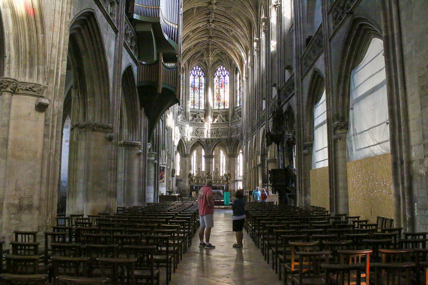 Inside Eglise Sainte-Pierre in Caen, Jerry Meyer and Jeanne Gee admire the architecture.
