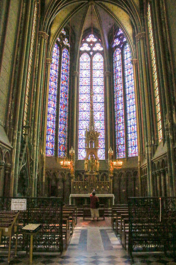 You can see the scale of Amiens Cathedral based on the person standing in front of the altar.
