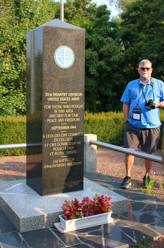 Dave Nore stands by the memorial to the 35th Infantry at Flavigny Bridge.