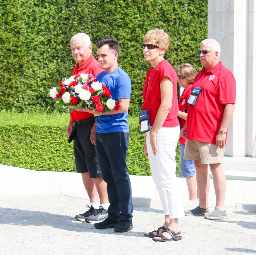 From left, Courtney Meyer, Nick Tuma and Connie Meyer prepare to lay the wreath at Luxembourg American Cemetery July 22 as Alan Baldwin watches.