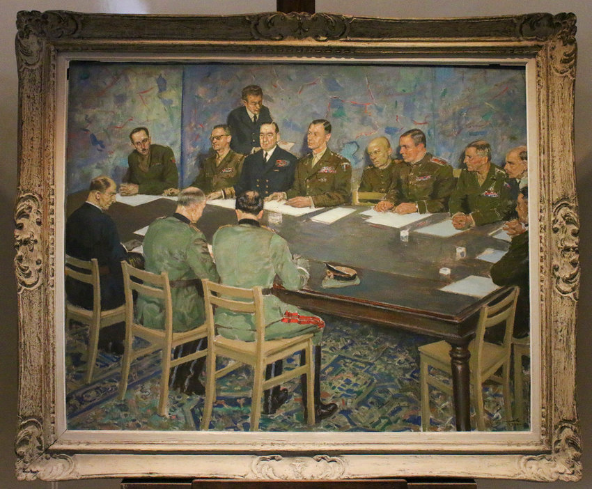 This painting, on display at the museum in Reims, shows where everyone was sitting during the official surrender signing.