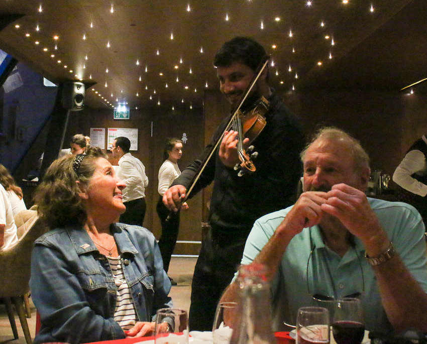 Tom and Jeanne Gee enjoy the live music on our dinner cruise July 23.