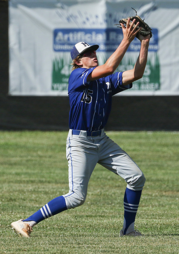 Malcolm left fielder Jake Clark hauls in a fly ball during district action in Yutan July 23.