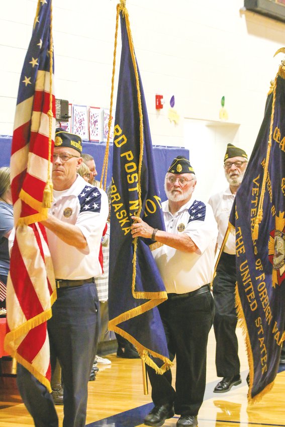 Members of American Legion Post 33, from left, Kirk Gottschalk, Alex Kufeldt and Lloyd Lipska retire the colors follwing Seward Elementary’s Veterans Day program Nov. 11. Peggy Brown (not pictured) was also part of the color guard.