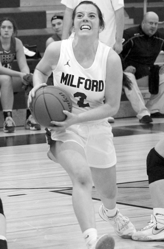 With an eye on the bucket, a determined Milford High School senior Kaitlin Kontor drives the lane against the Superior Wildcats during their Dec. 28 contest.