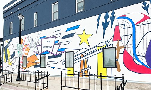 Seward High School graduate Nate Lewis painted a mural on the west side of Emily Nix Photography that represents the town of Seward.