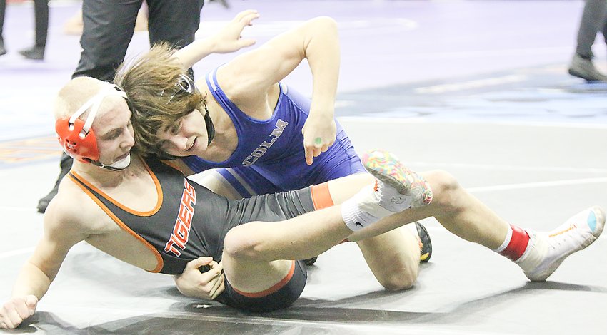 Cody Barton of Malcolm works for points against Jamison Duncan of Mitchell Feb. 17.