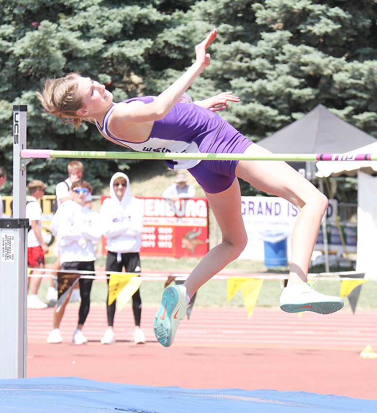 Sarah Spahr of Milford clears the bar in the high jump at state May 20. The MHS junior was the event champion.